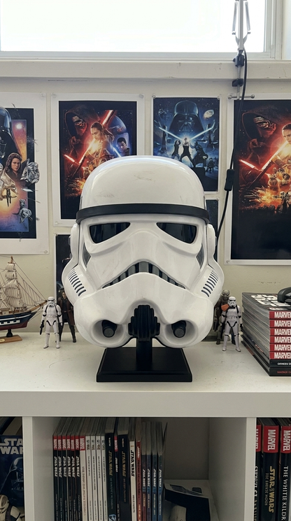 White resin display helmet on bookcase